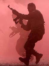 An Afghan National Army soldier demonstrates skills at a ceremony to mark the completion of the manning of the Army Corps in Kabul 