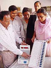 Election Commission officials explain the functioning of the electronic voting machine to various persons in Ambala