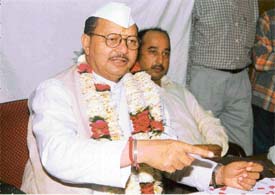 Former minister and Congress leader Dharam Pal Sabharwal addresses a press conference