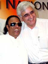 Music director and singer Ravindra Jain is greeted by Congress leader Salman Khurshid after Jain joined the Congress