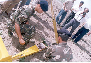 Army officials inspect a remote-controlled aero model, which crashed on the outskirts of Goraya in Jalandhar district