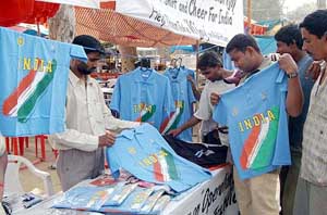 A man sells Indian cricket jerseys to fans going to Pakistan