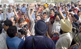 Cricket fans raise slogans against the police and administration