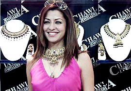 Model Aditi Govitrikar pose for a photograph during the inauguration of Zak Jeweles 2004 in New Delhi 