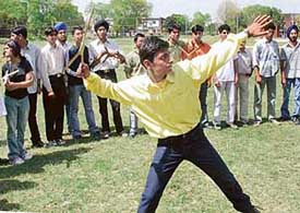 A student of Punjab Engineering College tests his skills in the boomerang design contest during Techfest-2004 in Chandigarh on Saturday. 