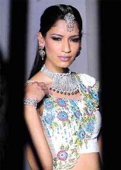 A model sporting multi-coloured antique jewellery in gold and diamond to celebrate the launch of ''Carat Couture'' by Manish & Nikhil at a fashion show in the Capital