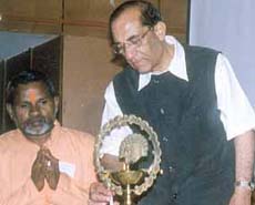 All-India Council of Sports president Prof Vijay Kumar Malhotra lighting a lamp to inaugurate the National Seminar on Yoga and Sports at the Talkatora swimming pool complex