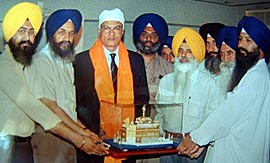 Mr Shivshankar Menon, India's High Commissioner in Pakistan, being honoured at the information centre of SGPC inside the Golden Temple