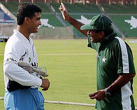 Indian captain Sourav Ganguly and Pakistani coach Javed Miandad share a light moment during a training session in Lahore 
