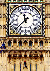 Greenpeace Demonstrators Harry and Simon scale London's landmark Big Ben clock tower in Parliament Square 