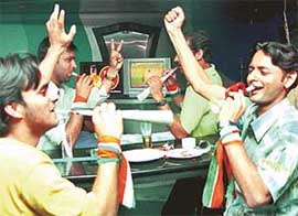 Youths celebrate the victory of the Indian cricket team at Lahore in Chandigarh on Sunday night.