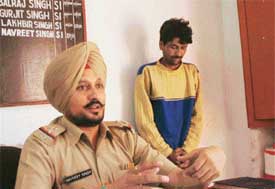 SHO of the Shimla Puri police station Navreet Singh produces Dimpy, alleged rapist of a minor, before mediapersons 