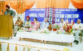 AICC secretary Dalbir Singh speaks at the annual prize distribution function of Shaheed Bhagat Singh College, watched by principal Dr Jitinder Kaur and former Union Minister Anil Shastri.