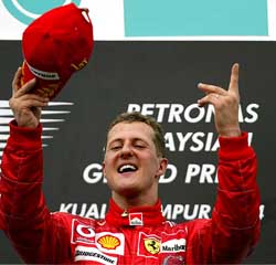 Ferrari's German rider Michael Schumacher  celebrates his victory at the Malaysian Grand Prix