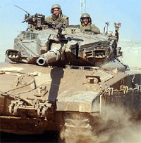 An Israeli tank pulls out of Gaza after an army operation near the Kisufim crossing on Sunday