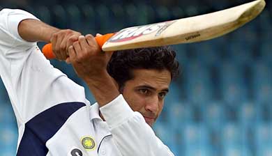 Irfan Pathan works on a batting shot during a training session in Lahore 