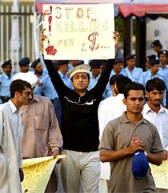 People gather for a peaceful protest against the killings in Wana outside the Parliament House in Islamabad on Monday