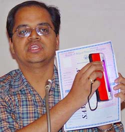 The Secretary of the Board of School Education, Haryana, Mr Rakesh Gupta, shows a tamper-proof answersheet in Panchkula