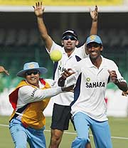 Virender Sehwag, Zaheer Khan and Lakshmiapati Balaji play handball during a training session