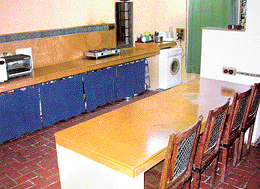 An open kitchen extends into the dining room.