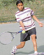 Navjot Saini of Punjab  plays a forehand shot to move in the third round of the girls� under-18 section of the AITA Talent Series Tennis Tournament at CLTA Tennis Stadium, Sector 10, Chandigarh, on Wednesday. 