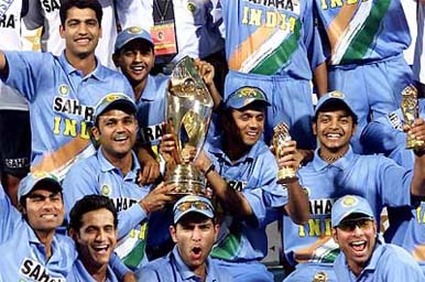 A jubilant Indian team pose with the trophy 