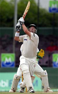 Australia's Darren Lehmann hits Sri Lanka's Muttiah Muralitharan for a six during the first day in the third Test at the Sinhalese Sports Club Ground in Colombo