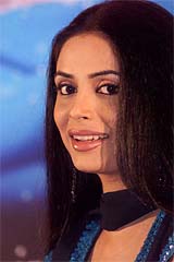 Bollywood actress Sheen smiles during a news conference to promote her film Sheen 
