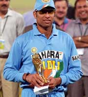Very Very Special Laxman strikes a pose with the 'Man of the Match' trophy