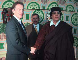 British Prime Minister Tony Blair shakes hand with Libyan leader Muammar Gaddafi in Tripoli 