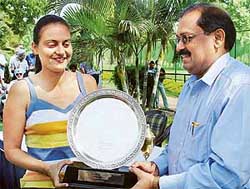 Mr A.P. Pandey, Chief Director, Vigilance Bureau, Punjab, gives away the Grewal Salver Trophy to Parnita Garewal at the prize distribution function of the Chandigarh Ladies Open Golf Championship held at the Chandigarh Golf Club lawns 