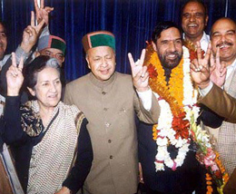 Himachal Pradesh Chief Minister Virbhadra Singh and Power Minister Vidya Stokes alongwith Anand Sharma showing victory sign