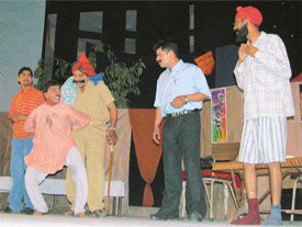Artistes perform a play �Mirch Masala� on the occasion of World Theatre Day at Punjabi Bhavan