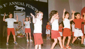 Students of Swiss International Public School present a dance on a ketchup song at the annual function of the school