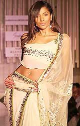 A model showcases a collection by designer Rocky S.