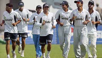 Indian players run during a training session