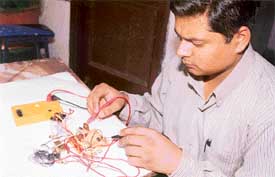 Suraj Manchanda demonstrates the working of his model of a circuit breaker