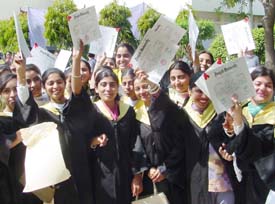 Jubliant graduates of the Guru Nanak College for Women, Model Town, with their degrees after the convocation