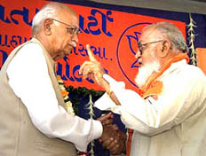 Deputy Prime Minister L.K. Advani shakes hands with a local Muslim leader during an election rally in Ahmedabad on Sunday. 