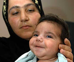 Forty-one-day-old Ali Sami Saad from Iraq lies on his mother's lap at a hospital in Chennai on Sunday