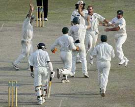 Australian players celebrate after defeating Sri Lanka on the final day of the third Test in Colombo 