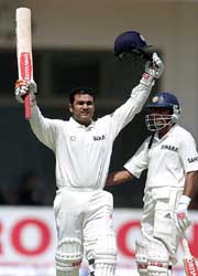 Virender Sehwag celebrates his century