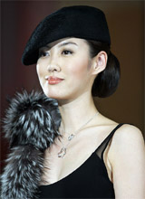 Japanese actress Rie Tomosaka displays diamond necklace during a diamond jewellery show in Tokyo on Tuesday. 
