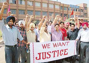 Students of Shaheed Udham Singh Engineering College, Tangori, raise slogans in support of their demands