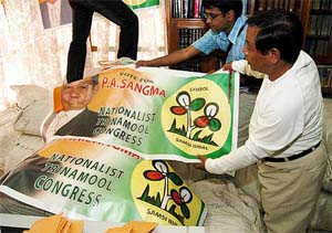 Nationalist Trinamool Congress candidate P.A. Sangma glances through election campaign material at his residence in Tura (Meghalaya)