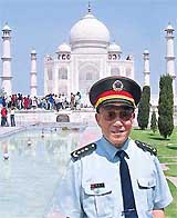 Chinese Defence Minister General Cao Gangchuan poses for photographers in front of the Taj in Agra on Tuesday. 