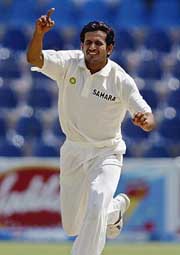India's Irafan Pathan celebrates after taking the wicket of Yasir Hameed
