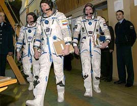 Cosmonauts Gennady Padalka of Russia, Andre Kuipers of the Netherlands and Michael Fincke of the USA head to undergo the last test training