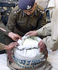 The police displays the seized RDX powder