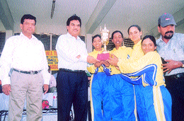 The Goa women�s team, who won the National Baseball Championship, with Jagdish Mittal and organising secretary P. C. Bharadwaj at the University ground.
